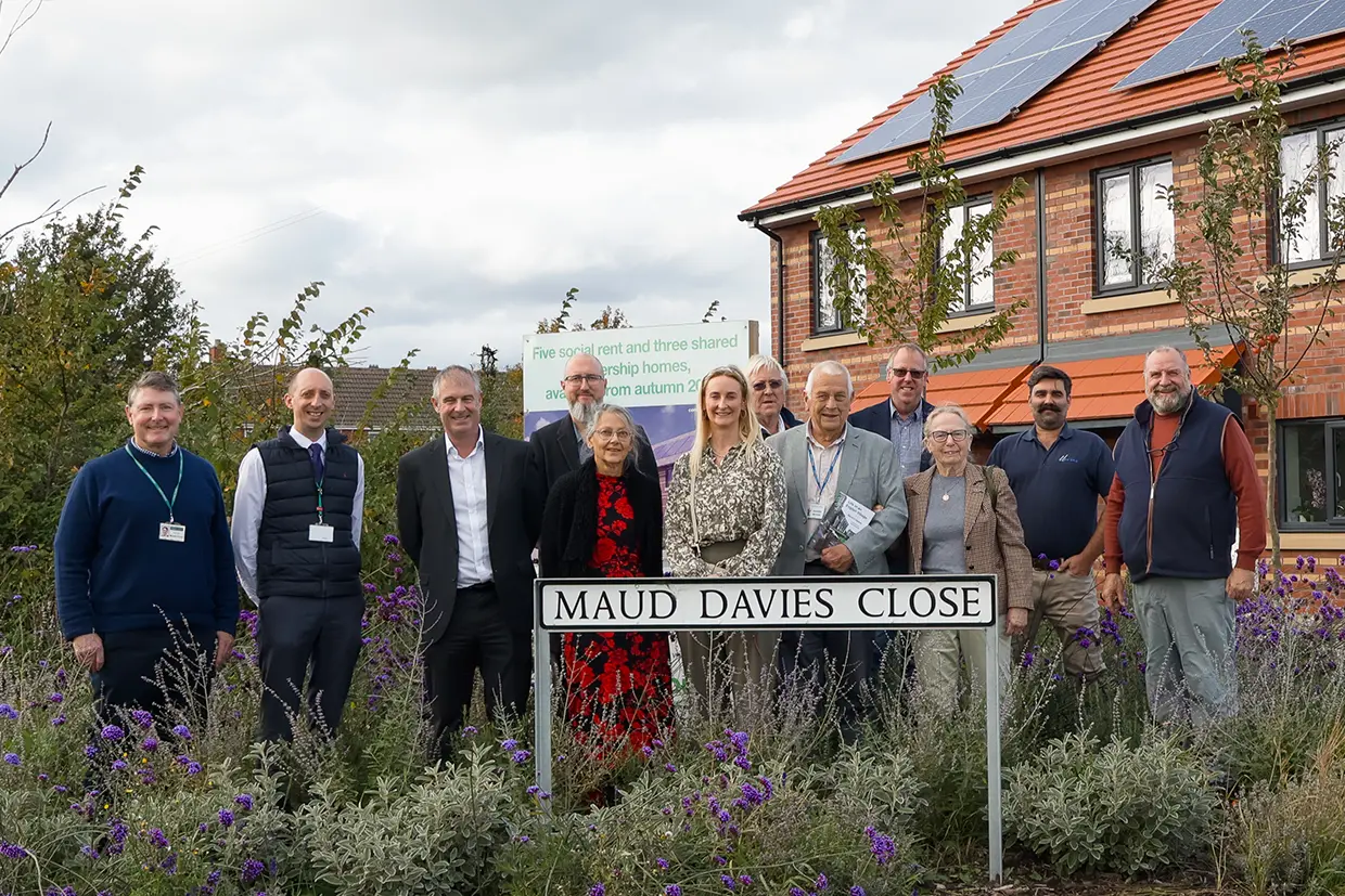 Maud Davies Naming Celebration group behind new street sign