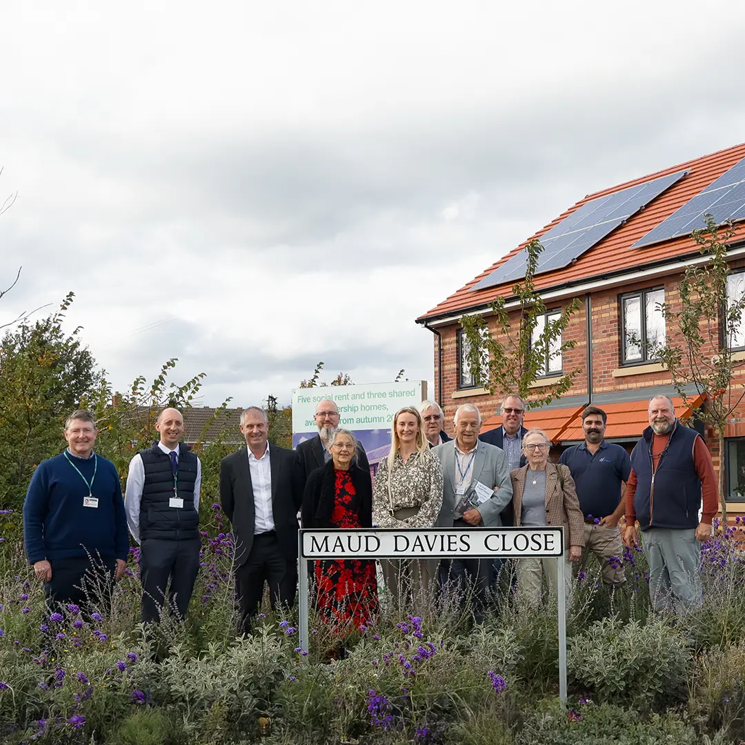 Maud Davies Naming Celebration group behind new street sign square